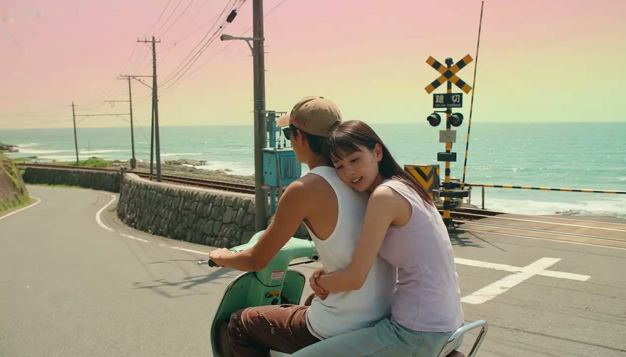 Grok Imagine AI video demo poster — coastal scooter ride